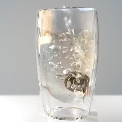 Hot water pouring into the glass