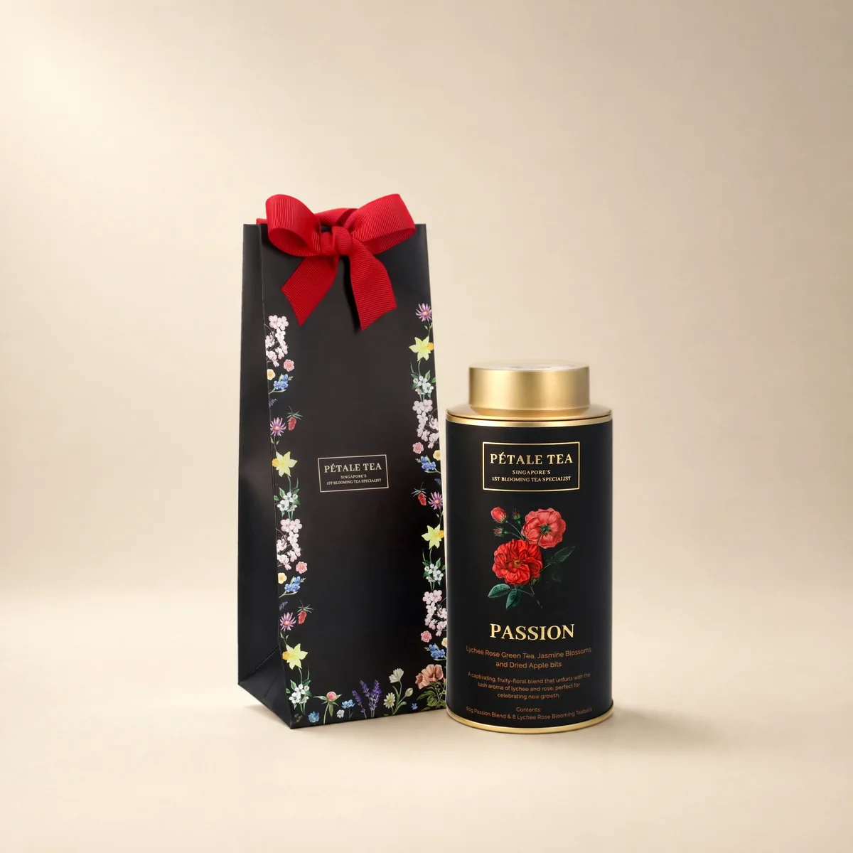 A Passion Classic tin with its black gift bag and red ribbon