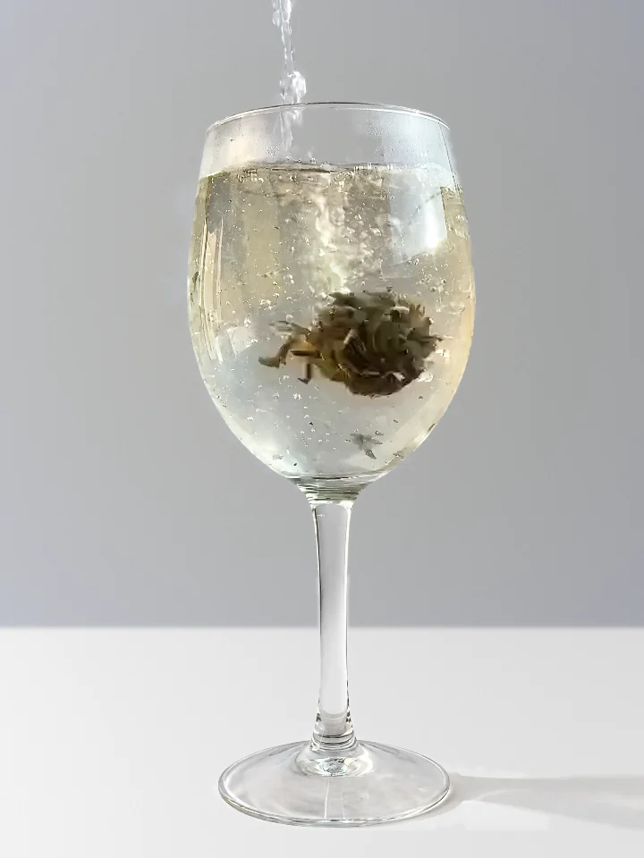 Hot water poured over the tea ball